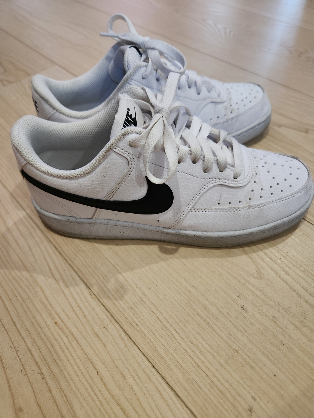 Nike White Leather Low-Top Sneakers with Black Swoosh